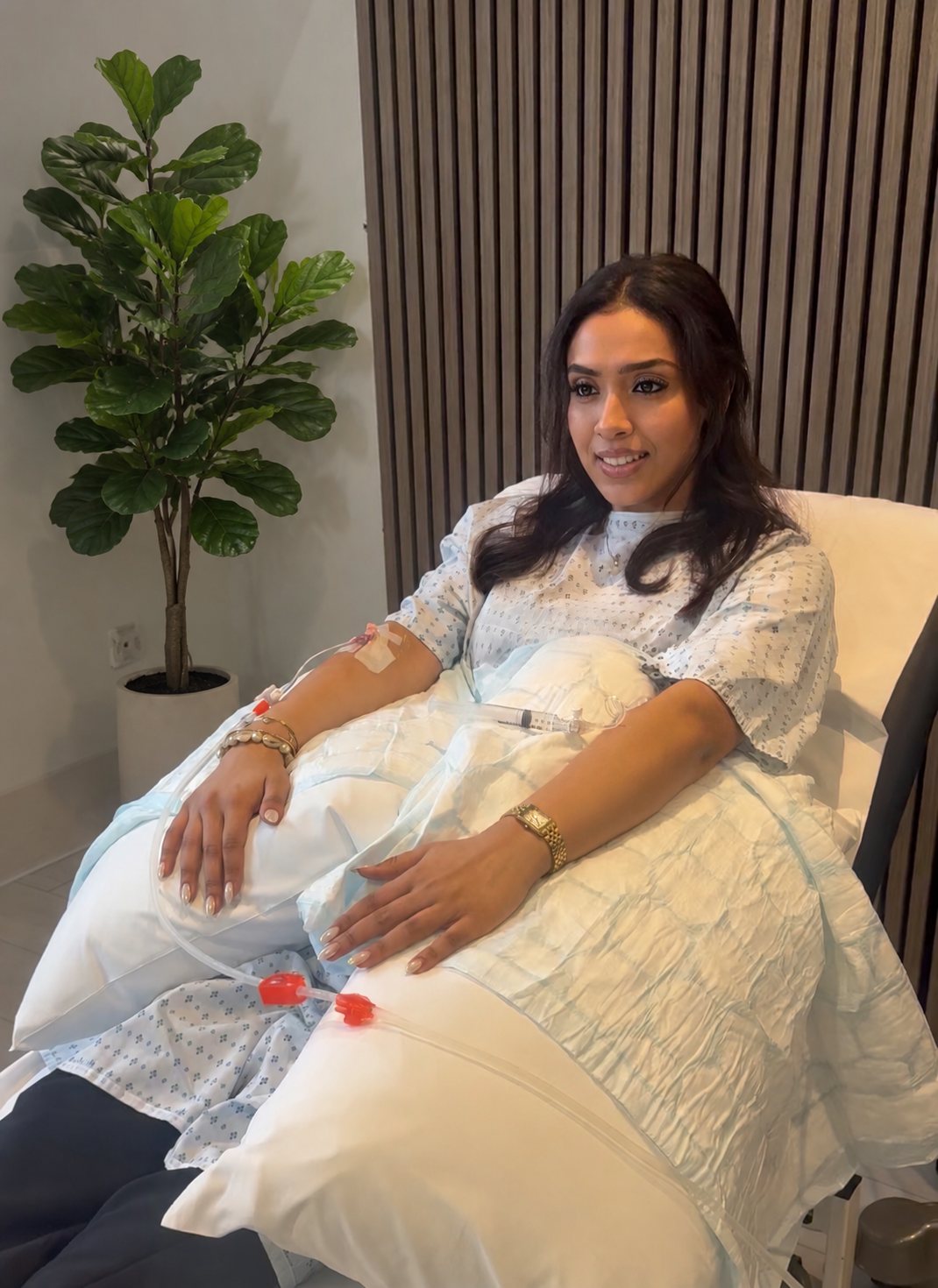 A smiling client relaxing during her EBOO therapy session